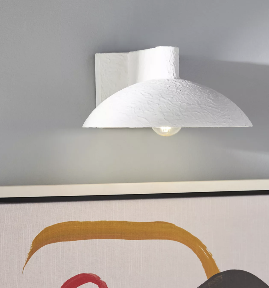 Domed mushroom shade sconce with plastered finish.