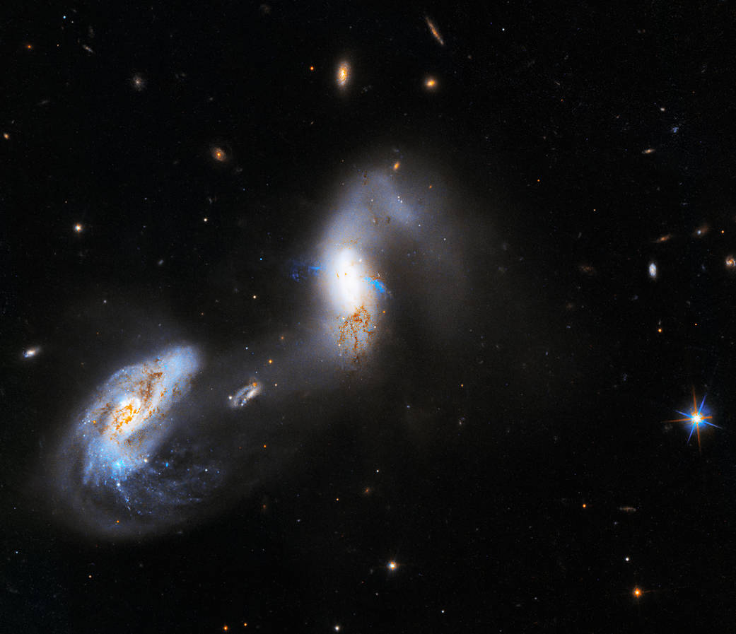 Two bright white galaxies in deep space