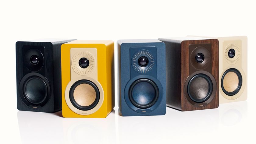 Five Dali Kupid bookshelf speakers in a range of colours arranged in a line on white background.