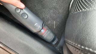 Vacuuming the footwell in the car with the eufy Clean H20