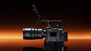 Fujifilm GFX Eterna 55 cinema camera with 32-90mm lens attached, punchy orange strip light in the background