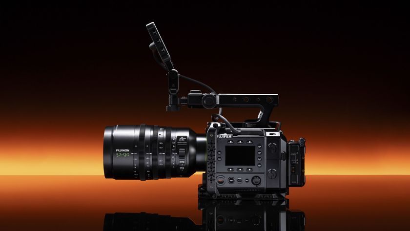 Fujifilm GFX Eterna 55 cinema camera with 32-90mm lens attached, punchy orange strip light in the background