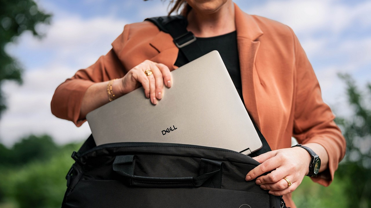 Dell Plus Laptop being removed from a bag