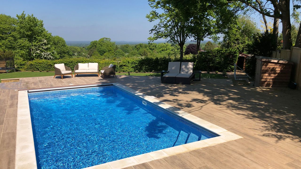 pool maintenance: outdoor pool with decking by Home Counties Pools &amp; Hot Tubs