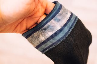 A close up of the cuff of a waterproof sock showing a waterproof gripper