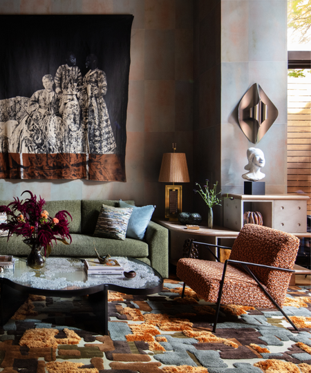 Velvet House Lounge by Dunnam Zerbini, featuring an artful rug, sculptural coffee table, and furniture upholstered with couture-grade fabrics.