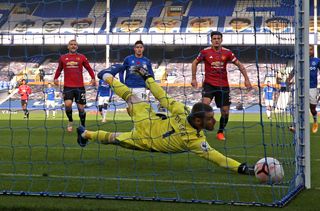 Manchester United goalkeeper David De Gea dives in vain to try and keep out Bernard's shot