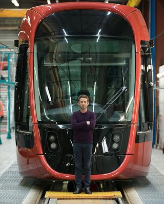 Ora ïto standing in front of his new tram