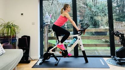 Woman riding indoor smart bike