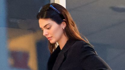 Kendall Jenner wearing a black jacket and wide-leg jeans to Sushi Park in Los Angeles May 2024