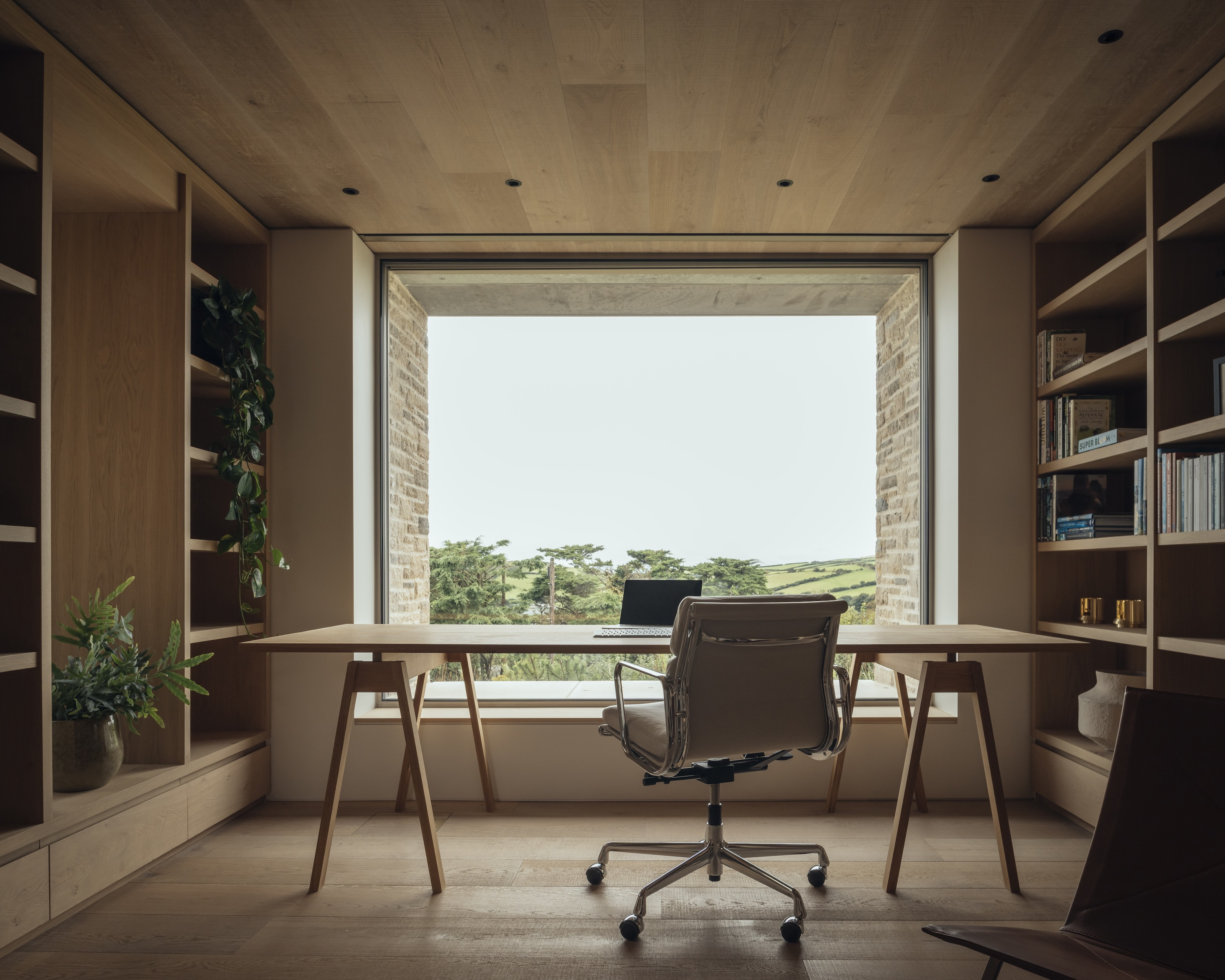 A shelf-lined study is located next to the internal courtyard