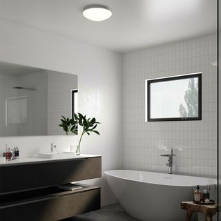 bathroom with round ceiling light