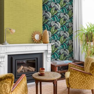 living room with green colour wall paper and yellow sofa and fire place