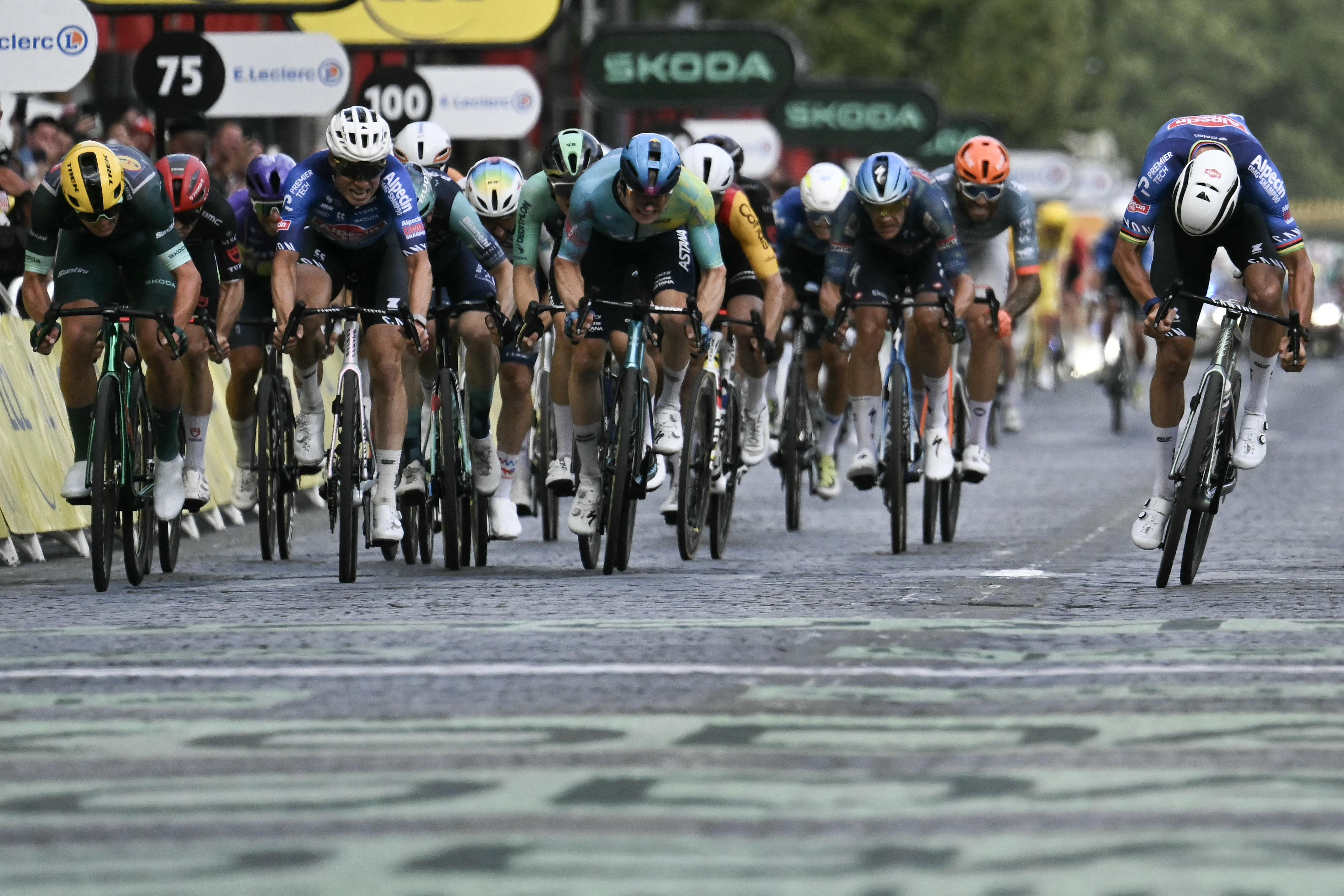 Alpecin - Premier Tech rider Mathieu van der Poel (R) crosses the finish line to win stage 21