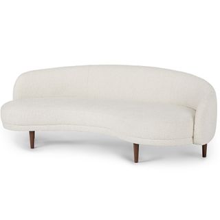 A curved boucle sofa