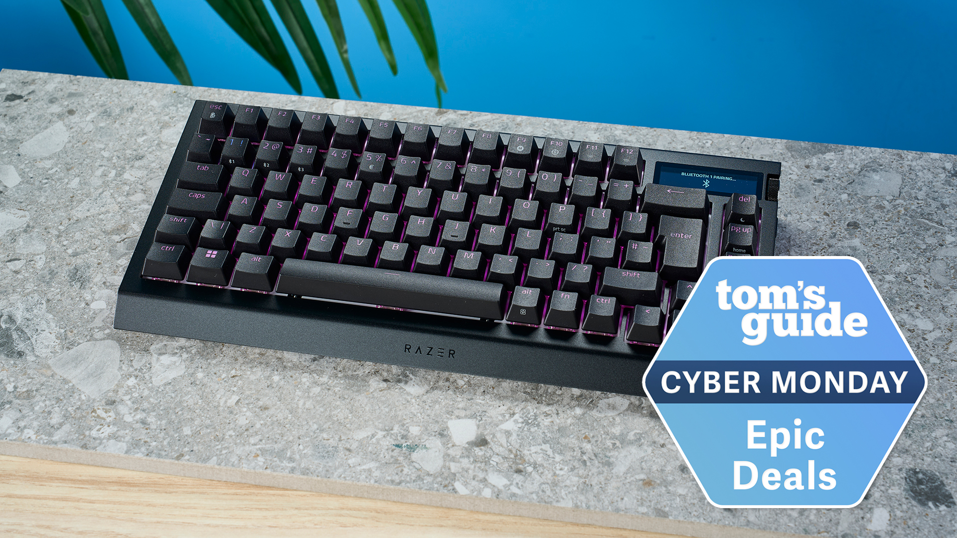 The Razer BlackWidow V4 Pro on a slate surface with a blue background. A Tom&#039;s Guide Cyber Monday deal badge is in the bottom right hand corner of the image.