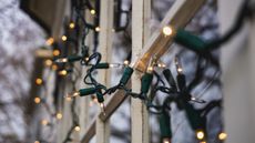 Christmas lights against a window 