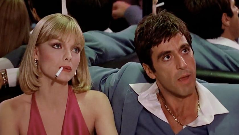 Michelle Pfeiffer and Al Pacino, in 80s attire, in Scarface (1983).