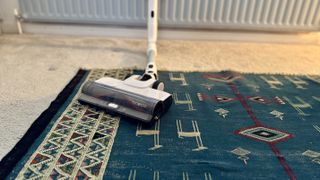 Floorhead on Tineco Pure One A50S cordless stick vacuum bent at an angle