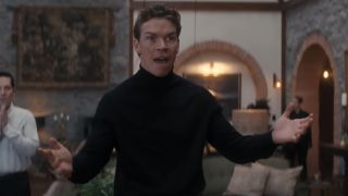 Will Poulter making an excited gesture in Death of a Unicorn