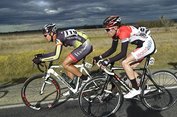 Christopher Williams (left) of the Merida Australia team and Jay Bourke (Search2Retain/MyTeam2) in the peloton during stage five.