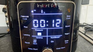 instant pot pro plus showing 12 minutes on the pressure cook setting