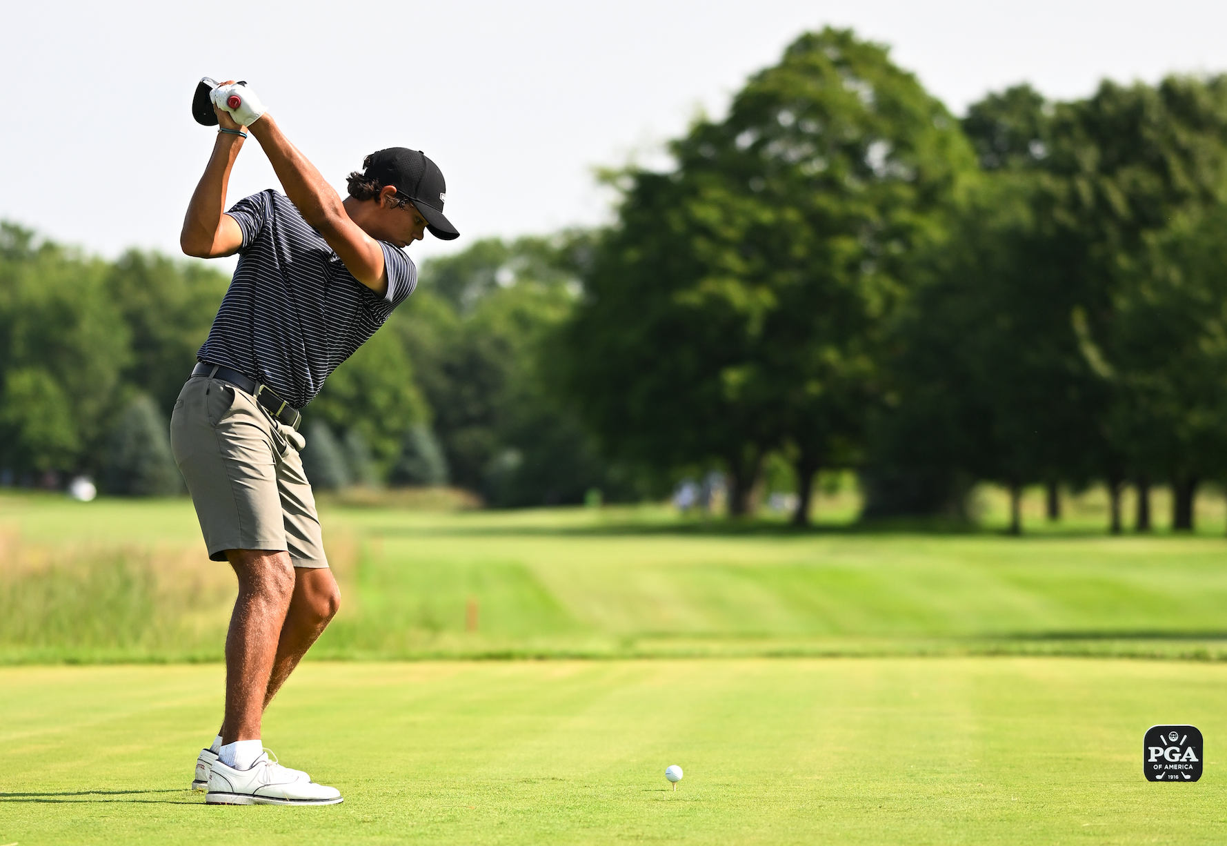 Charlie Woods at the top of his backswing during a drive at the Junior PGA Championship
