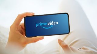 Amazon Prime Video logo on a phone being held by someone