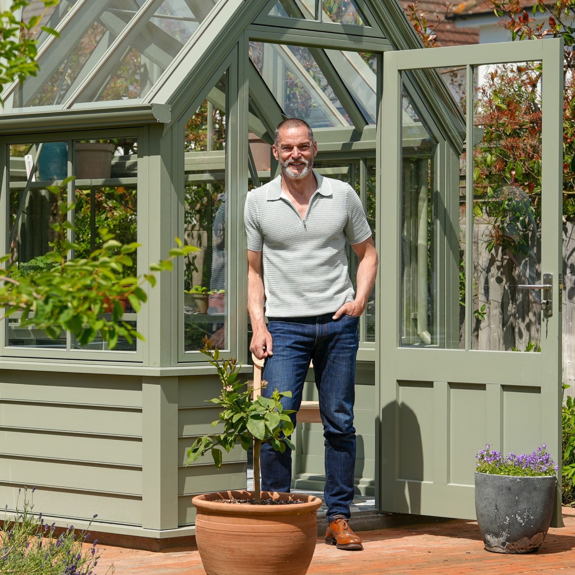 Fred Sirieix standing outside of Hampton The Causeway greenhouse