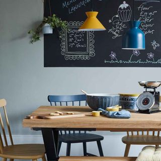 kitchen with chalkboard and table and chair