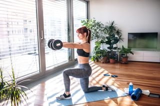 Woman with best workout equipment for home 