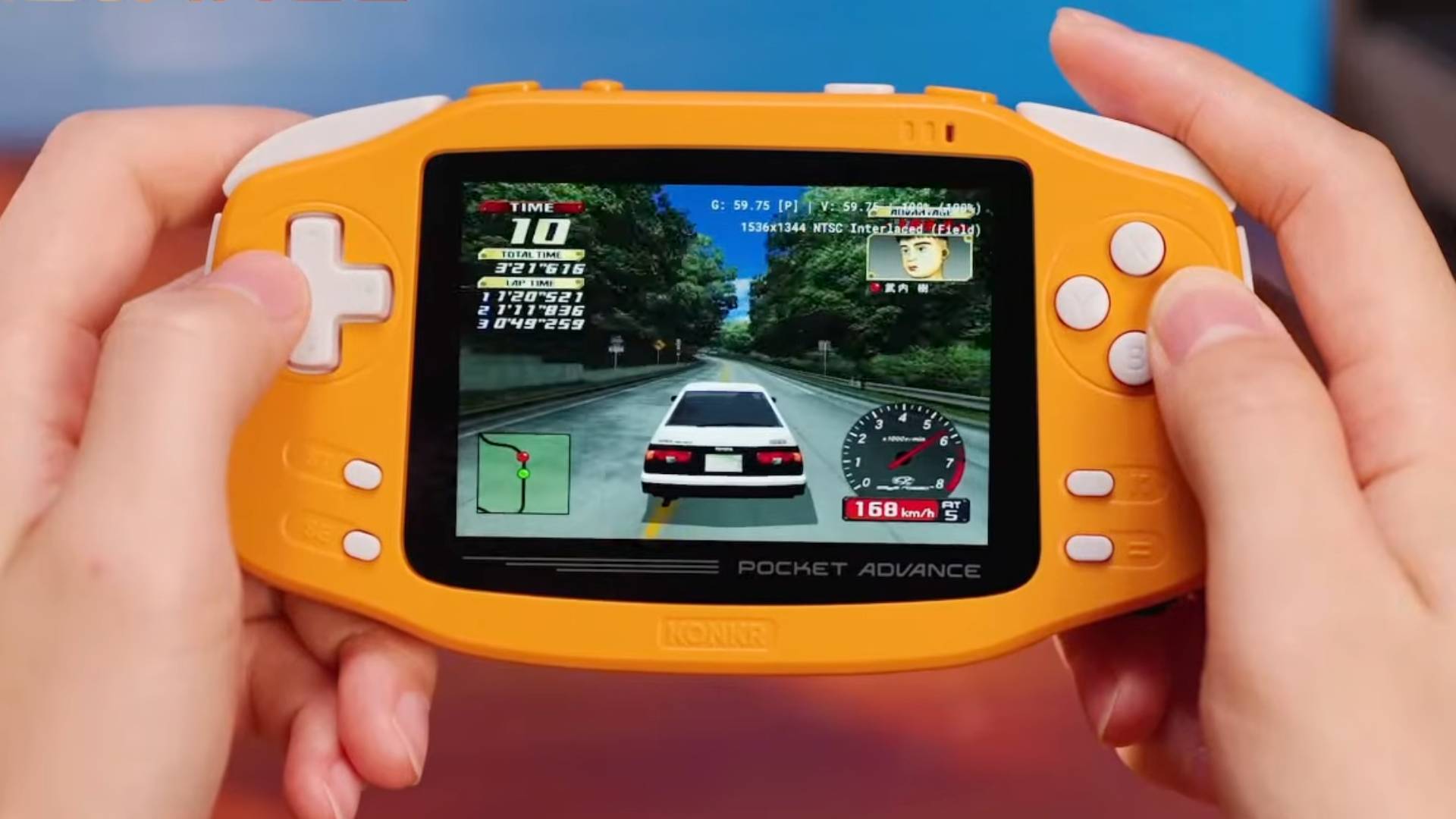 Hands using KONKR Pocket Advance in coral (spiced orange) to play Initial D Special Stage.