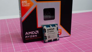 An AMD Ryzen 9 9950X3D leaning against its retail packaging