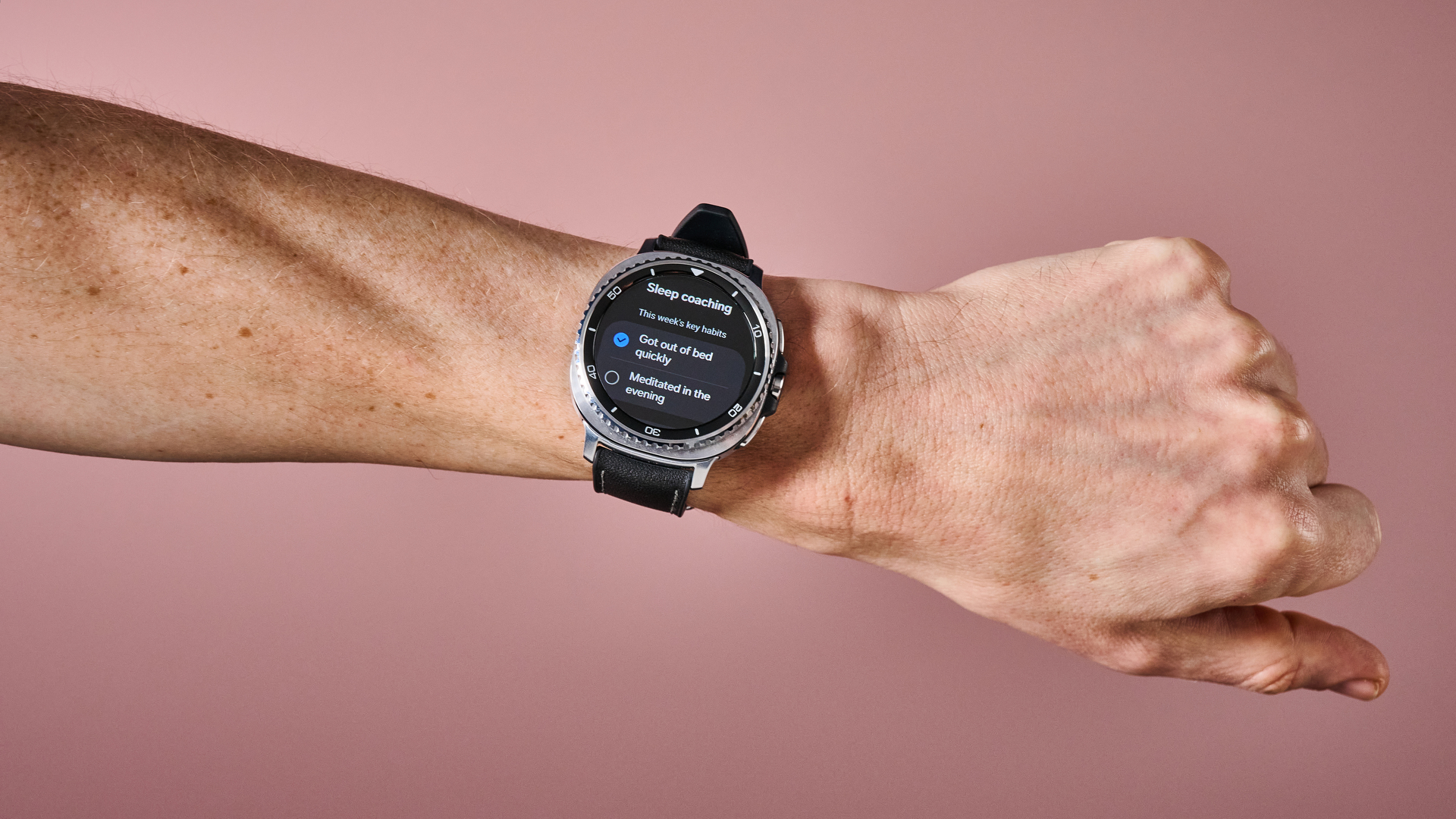 The Samsung Galaxy Watch 8 Classic on a man's wrist showing its Sleep Coaching tips.