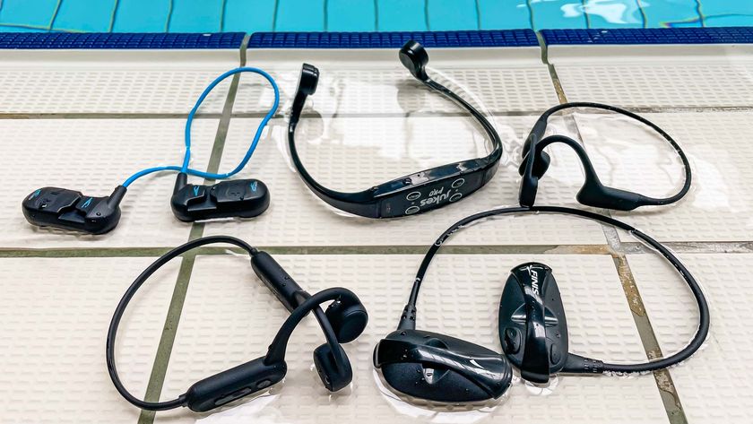 A collection of waterproof headphones next to a swimming pool