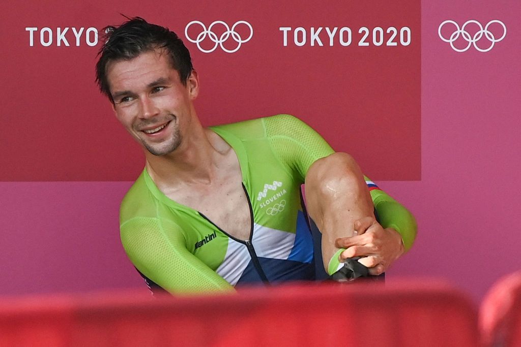 Gold medalist Slovenias Primoz Roglic reacts after winning the mens cycling road individual time trial during the Tokyo 2020 Olympic Games at the Fuji International Speedway in Oyama Japan on July 28 2021 Photo by Greg Baker AFP Photo by GREG BAKERAFP via Getty Images