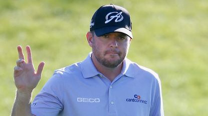 Robert Garrigus waves to the crowd