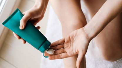 Simple skincare tips - woman squeezing moisturiser into her hands