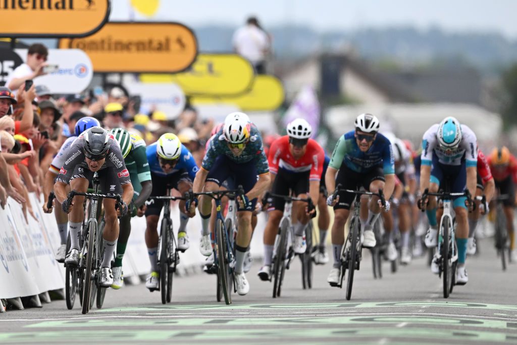 SAINTAMANDMONTROND FRANCE JULY 09 LR Stage winner Jasper Philipsen of Belgium and Team Alpecin Deceuninck Biniam Girmay of Eritrea and Team Intermarche Wanty Green Sprint Jersey Wout Van Aert of Belgium and Team Visma Lease a Bike Sam Bennett of Ireland and Decathlon AG2R La Mondiale Team and Phil Bauhaus of Germany and Team Bahrain Victorious sprint at finish line during the 111th Tour de France 2024 Stage 10 a 1873km stage from Orleans to SaintAmandMontrond UCIWT on July 09 2024 in Orleans France Photo by Tim de WaeleGetty Images