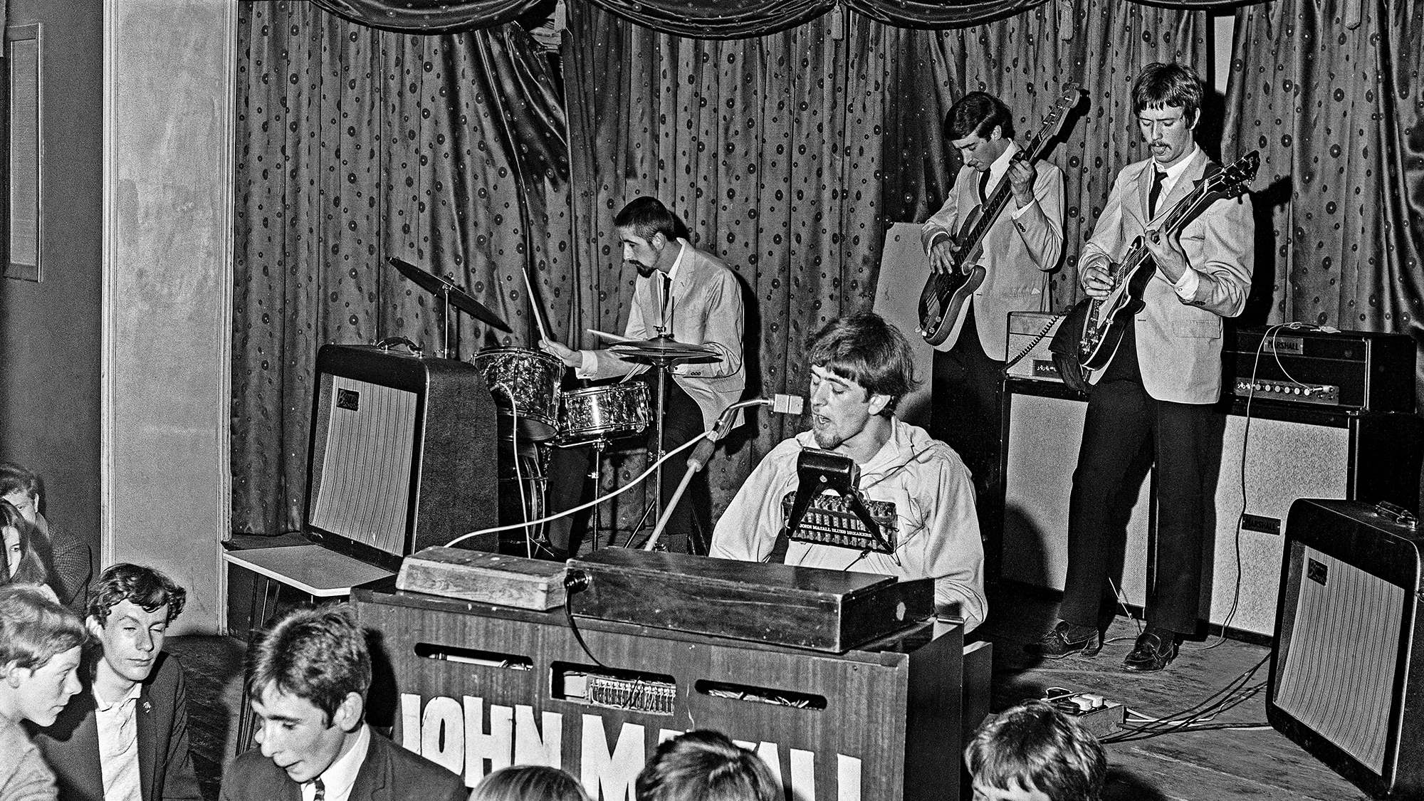 John Mayall's BluesBreakers on stage at The Ricky-Tick Club, Plaza Ballroom Guildford, Surrey. 4th June 1965. (from left) Hughie Flint, Mayall, John McVie and Eric Clapton