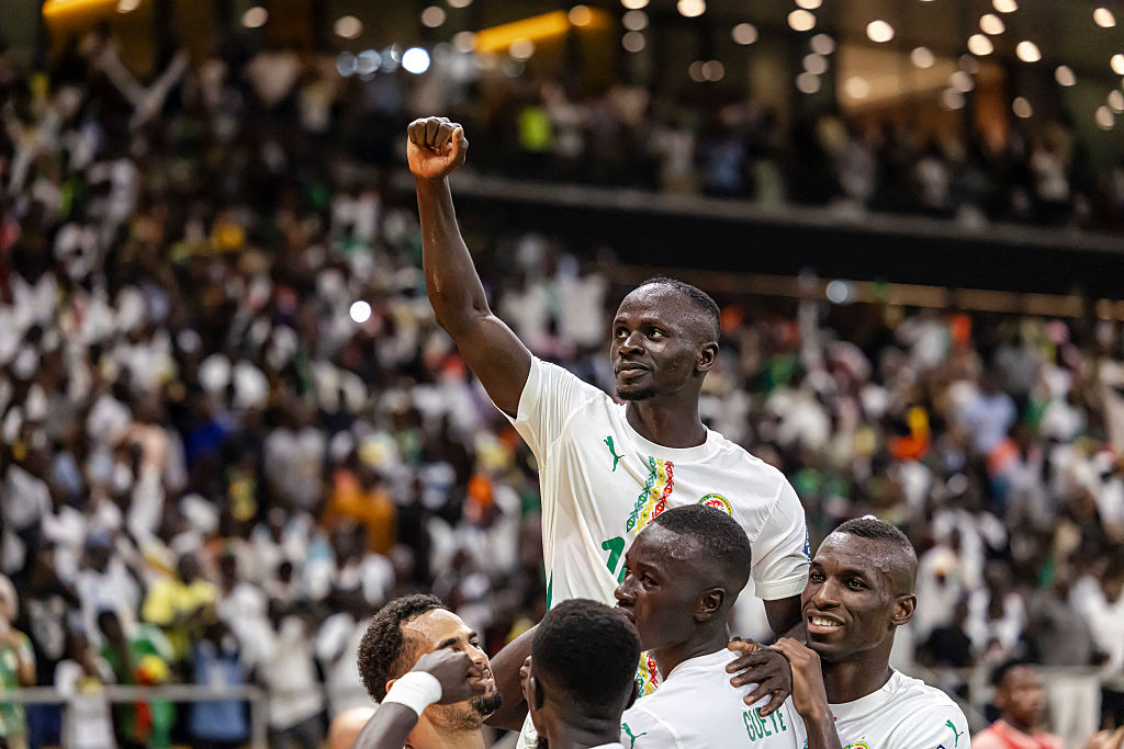 Senegal&#039;s forward #10 Sadio Mane (C) celebrates with teammates after scoring a goal during the FIFA World Cup 2026 Africa qualifiers Group B match between Senegal and Mauritania at the Stade Abdoulaye Wade, in Diamniadio, on October 14, 2025. (Photo by Patrick Meinhardt / AFP)