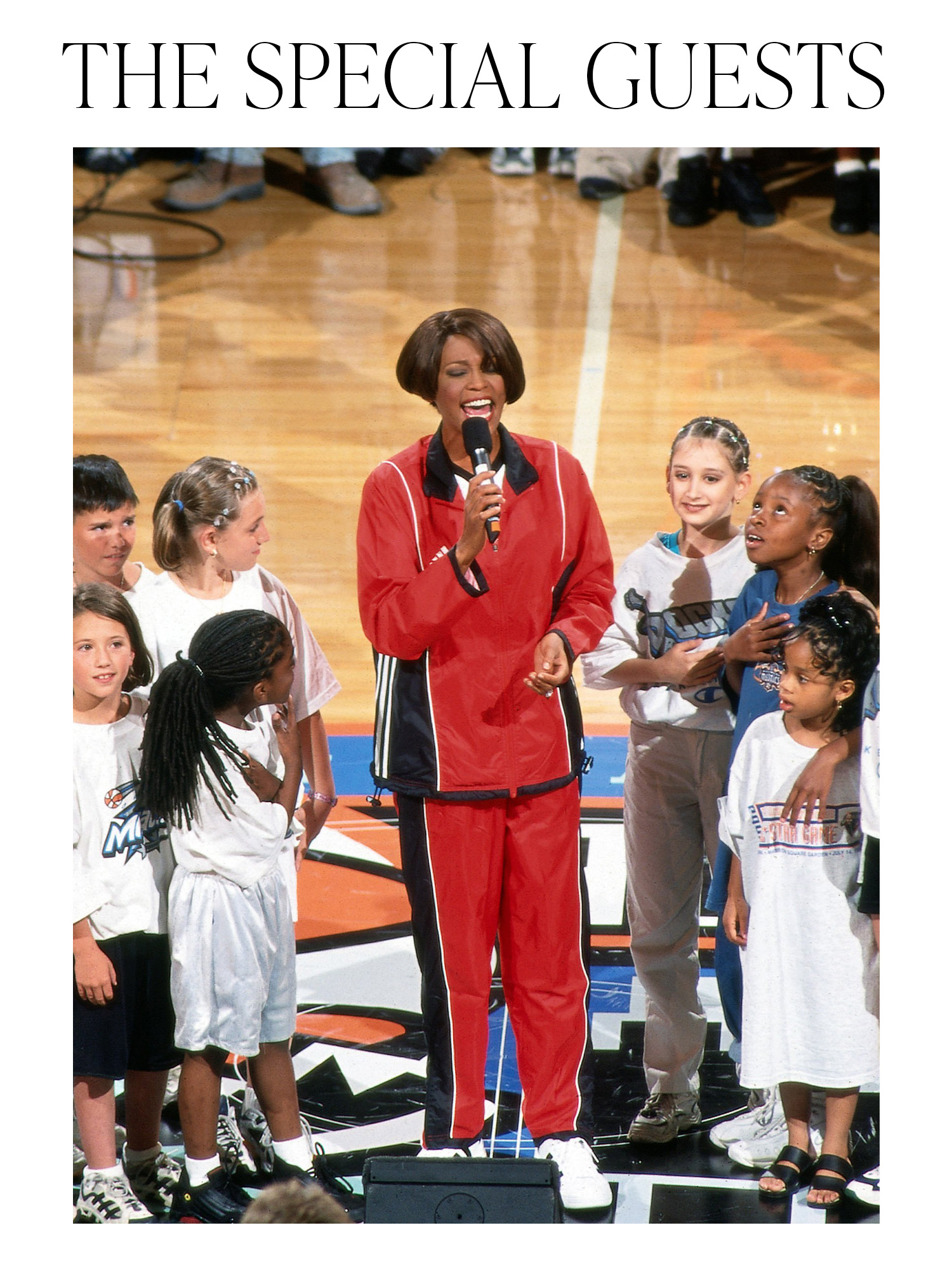 Whitney Houston singing at the first WNBA All-Star Game in 1999 with the words "the special guests" printed on top.