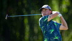 Jeffrey Guan strikes a fairway wood off the tee at the Procore Championship