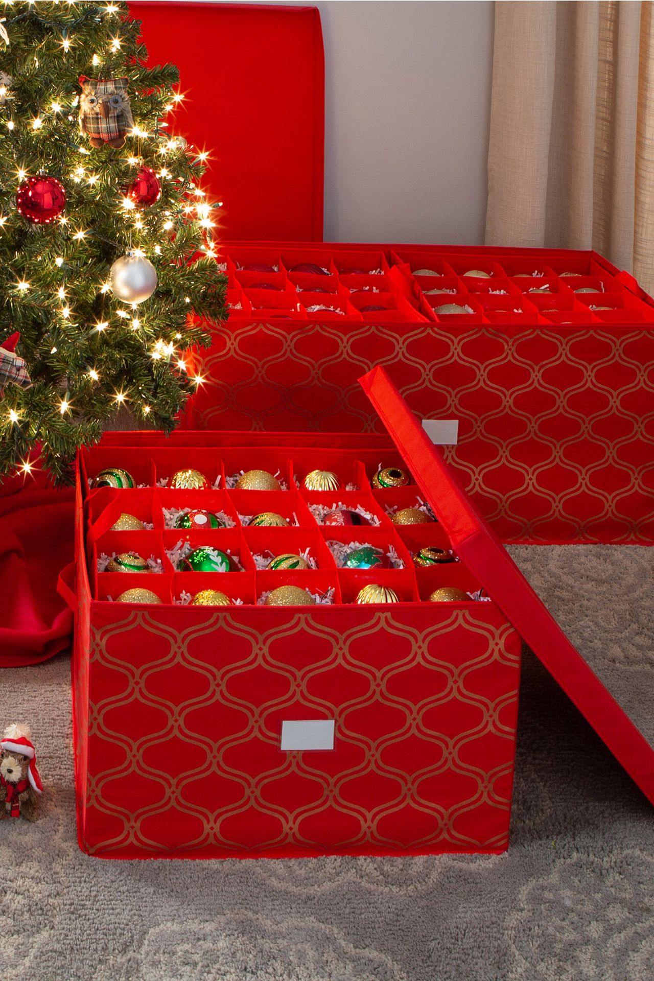 Red Christmas decoration boxes beside the Christmas tree