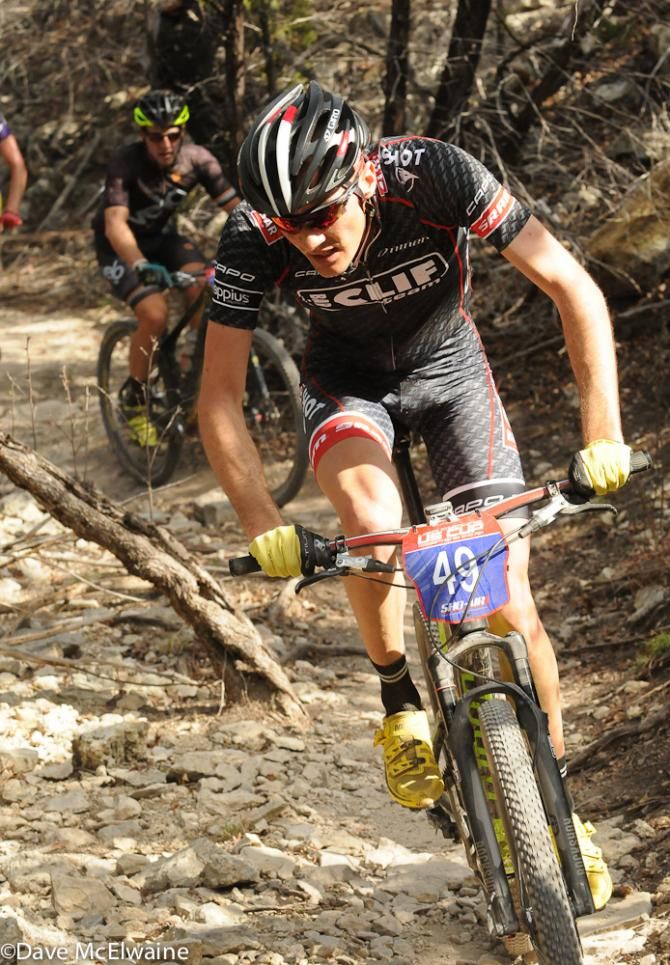 A Team Clif Bar rider on twisty limestone singletrack