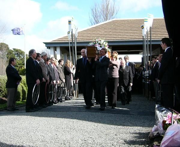 Amy Gillett is carried from the chapel by her husband Simon (left-front) and pallbearers.