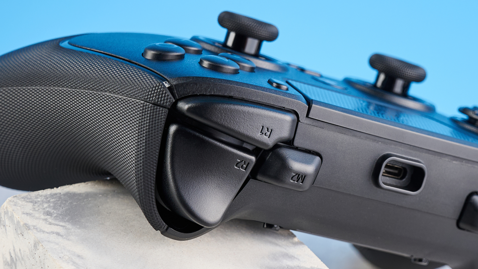 A black Razer Raiju V3 Pro controller for PS5