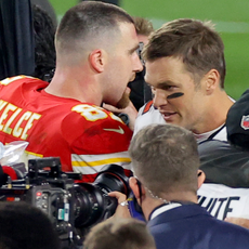 Travis Kelce #87 of the Kansas City Chiefs and Tom Brady #12 of the Tampa Bay Buccaneers speak after Super Bowl LV at Raymond James Stadium on February 07, 2021 in Tampa, Florida.
