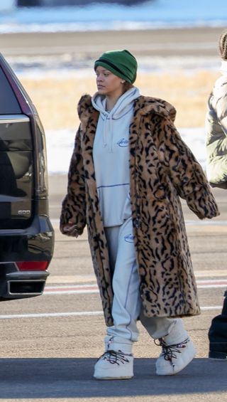 rihanna wearing a leopard coat and gray sweats 2024