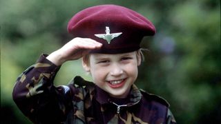 Prince William as a child, saluting